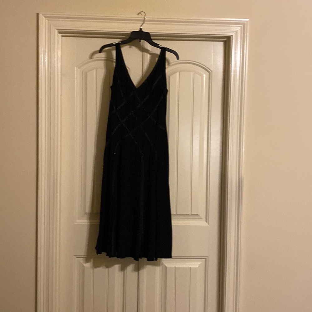 Black sleeveless dress.
